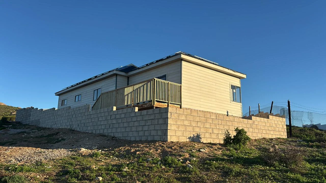 Completed fibre-cement structure on a hillside