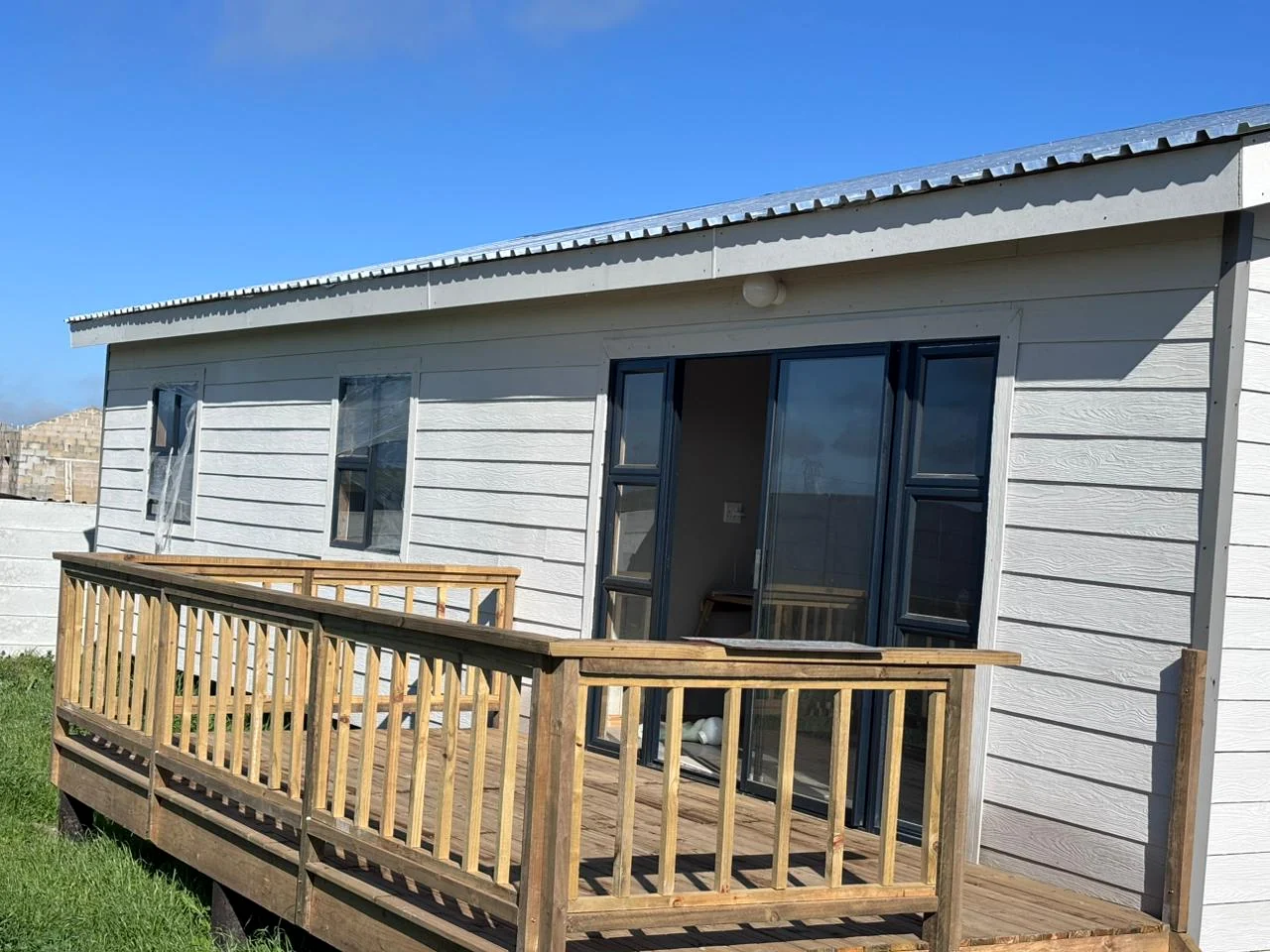 Finished fibre-cement home with timber deck